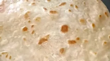 Rajma paratha wrap stuffed with rajma tikki, vegetables, and cheese 4